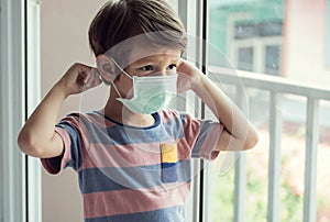 A boy wearing face mask to protect virus
