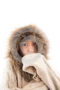 Little boy wearing fur coat protect from cold snow over head