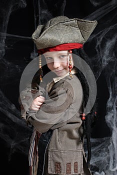 Little boy wearing pirate costume