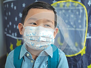 Little boy wearing protective mask protection