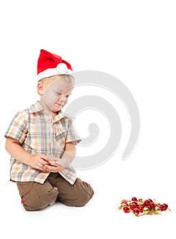 Little boy wearing a Santa hat bles