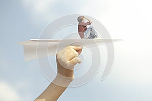 a little boy who flies free over a paper airplane