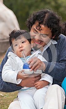 Little boy wiht father in the street