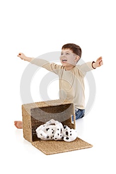 Little boy yelling happily at dog