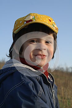 little boy in yellow cap