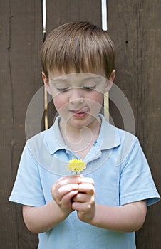 Little Boy with Yellow Flower