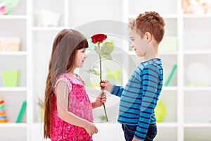 Little boyfriend giving flower