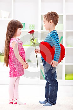 Little boyfriend giving flower