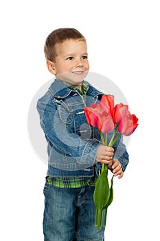 Little boyl with red tulips