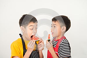 Little boys blend water melone juice by using blender home