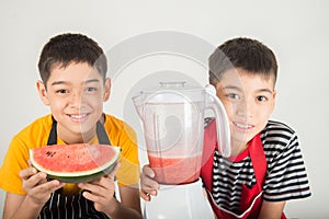 Little boys blend water melone juice by using blender home