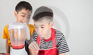 Little boys blend water melone juice by using blender home