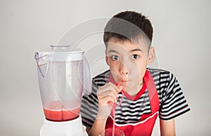 Little boys blend water melone juice by using blender home