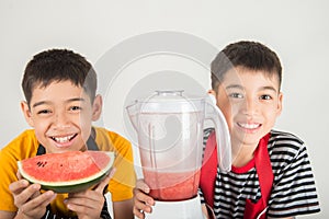 Little boys blend water melone juice by using blender home