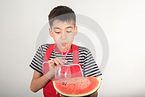 Little boys blend water melone juice by using blender home