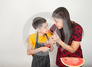 Little boys blend water melone juice by using blender home