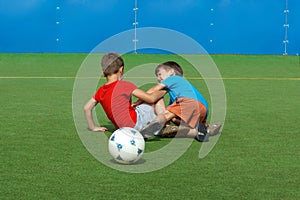 Little boys fault on soccer field photo