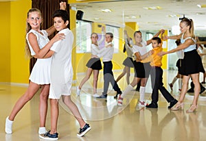 Little boys and girls having dancing class in classroom