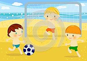 Little boys playing football on the beach