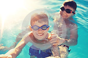 Little boys playing in swimming pool