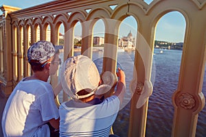 Little boys showing Parliament bulding at Budapest photo