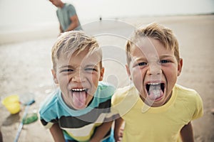 Little Boys Sticking their Tongues Out