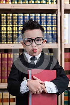 Little boys in suit looking and choose book