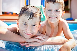 Little boys in swimming pool
