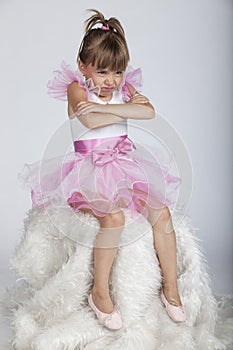 Little brat ballerina holding her arms crossed photo