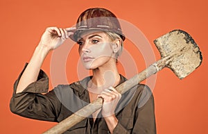 little break. engineer on orange background. foreman girl wear safety hardhat.