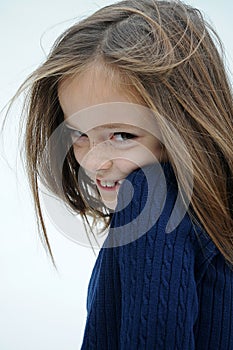 Cheekily schoolgirl with long hair and freckles