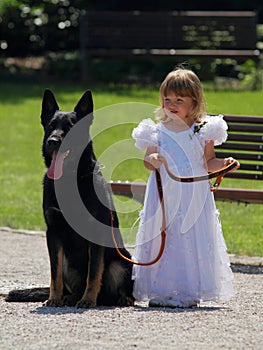 A little bridesmaid and her dog.