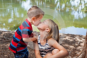 Little Brother Kisses Sister On Lips