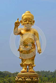 The little Buddha golden statue at Lumbini, Nepal