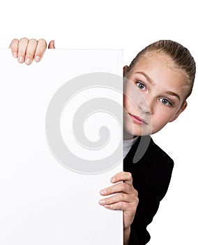 Little business woman standing behind and leaning on a white blank billboard or placard, expresses different