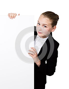 Little business woman standing behind and leaning on a white blank billboard or placard, expresses different