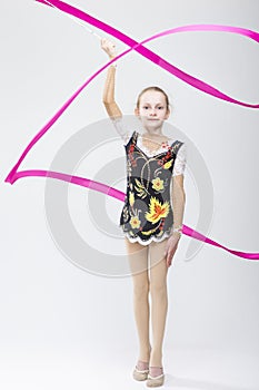 Little Caucasian Female Rhythmic Gymnast In Professional Competitive Suit