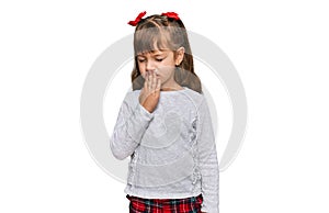 Little caucasian girl kid wearing casual clothes bored yawning tired covering mouth with hand