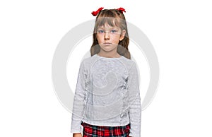 Little caucasian girl kid wearing casual clothes relaxed with serious expression on face