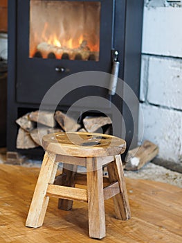 Little chair in front of a fireplace