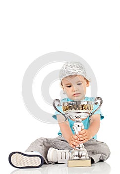 Little champion with his trophy
