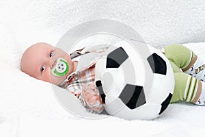 Little chap with soccer ball on white background photo