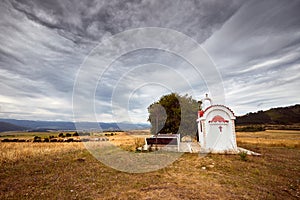 A little chapel and a herd of sheep