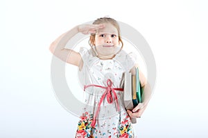 A little cheerful girl with textbooks.