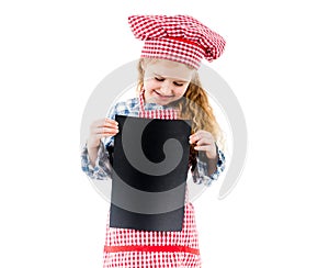 Little chef girl holding piece of paper with free space, isolated