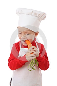 Little chief-cook tasting the carrot