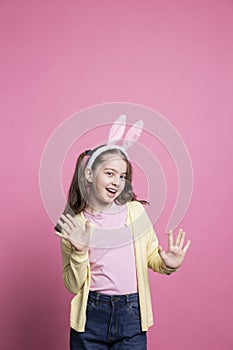 Little child acting excited and cheerful about easter festivity