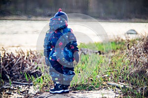 little child alone near river