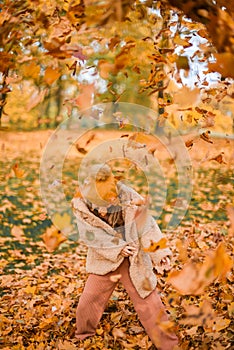 Little Child Baby Girl Caucasian Walking in Park with Leaf Autumn