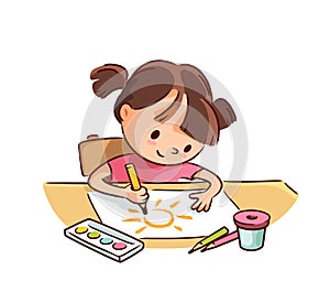 Little child baby girl drawing picture with pencils and watercolor sitting at the table